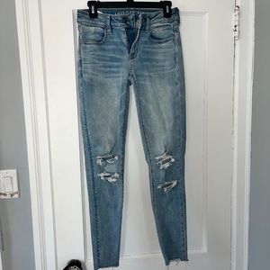 AMERICAN EAGLE ripped low rise skinny jeans